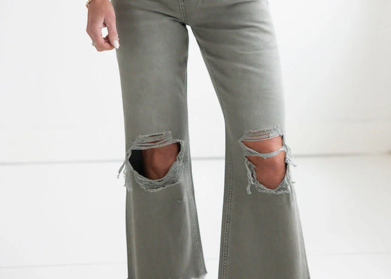 Womens jeans with distressing in the knees.